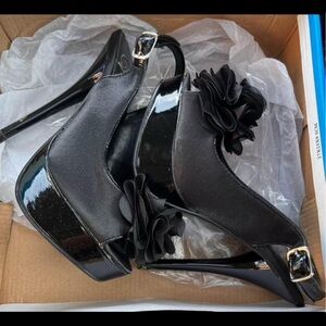 Black satin “mydeliciousshoes.com” heels